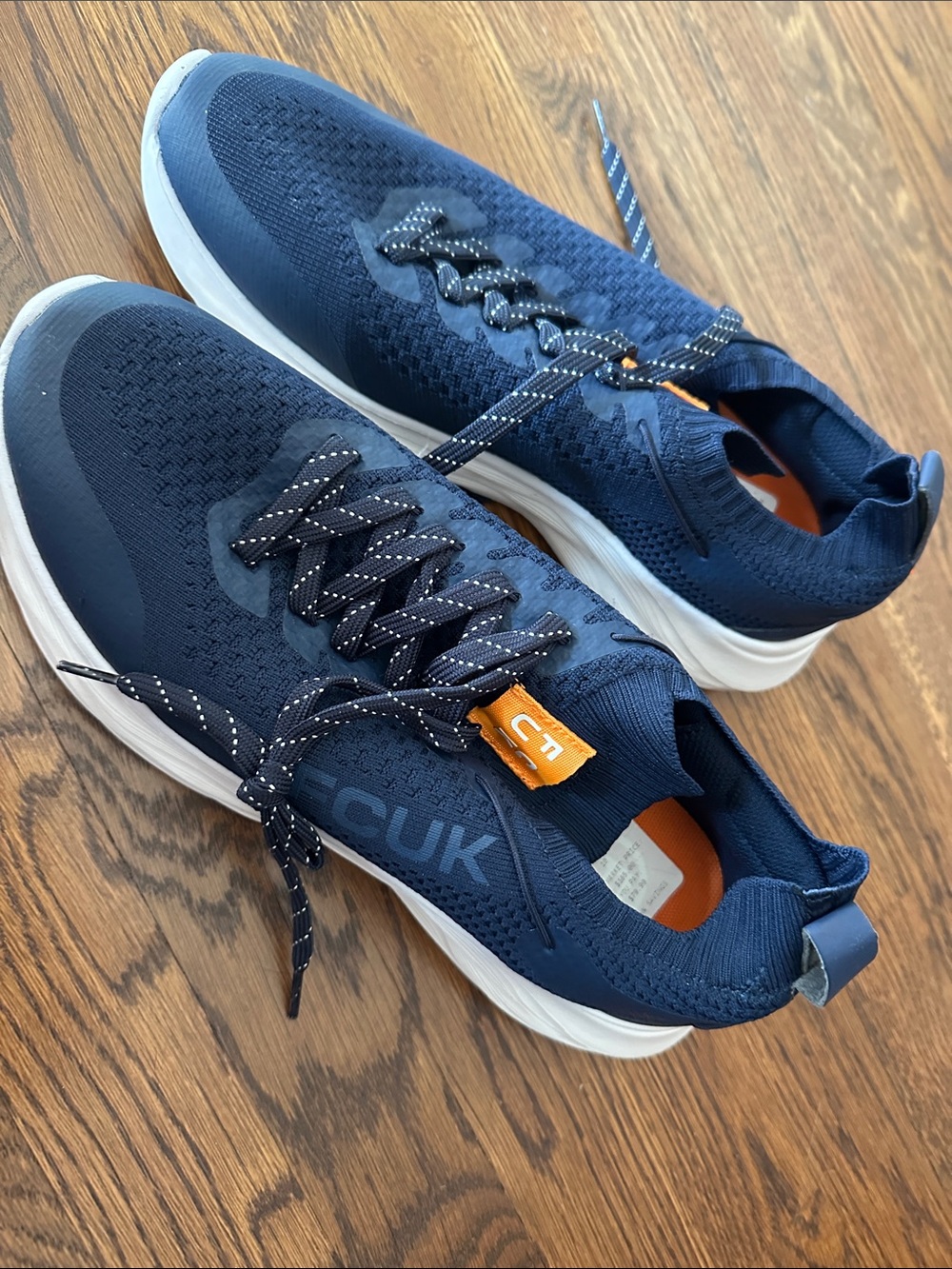 French Connection Navy Knit Athletic Sneakers with White Soles and Orange Accent